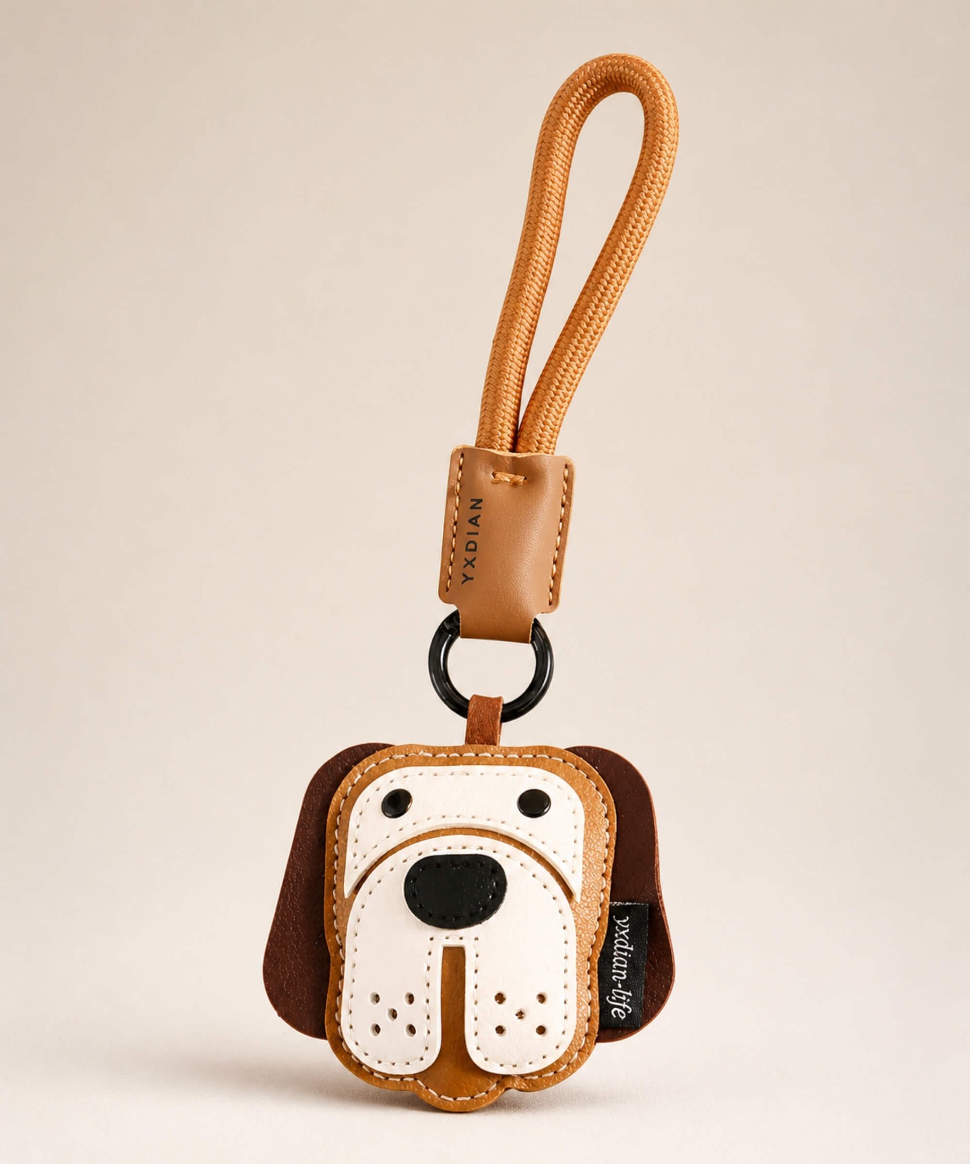 Beagle face PU leather bag charm keychain on a neutral background.